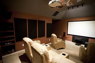 Home theater with projector and tiered seating